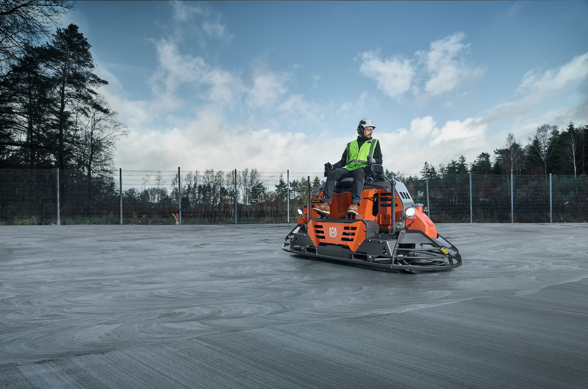 Husqvarna CRT 48 Ride-On Trowel in Action on Concrete Job Site